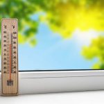 36540079 – thermometer on the windowsill on the background of the summer heat